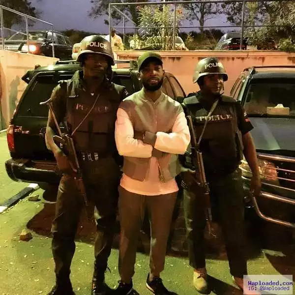 British-Nigerian Rapper, Tinie Tempah, Poses With Armed Men As He Arrives Abuja